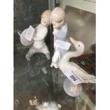 Lladro goose, and two other Lladro figures