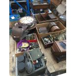 A table top of clocks and clock parts, and also including a watch cleaning machine, French