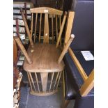 a pair of retro spindle back chairs