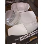 A box of white dinerware.