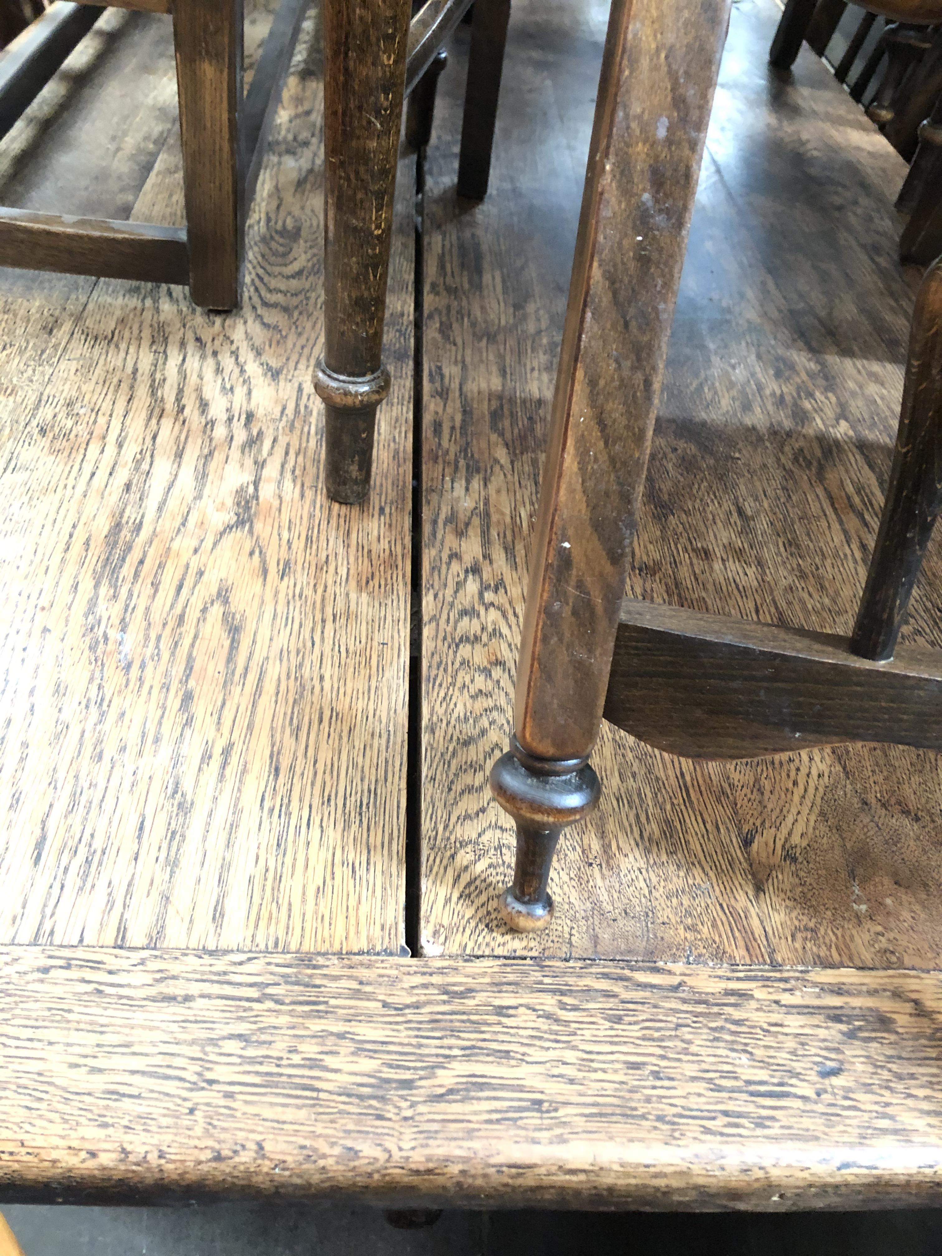 A large oak two plank and cleated end refectory table together with eight spindle back chairs - Bild 2 aus 7