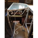 A vintage wrought metal and glass demi lune table