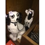 A pair of reproduction Staffordshire dog ornaments