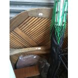 A large wooden garden table with a lazy susan.