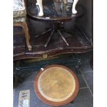 A cart wheel style glass top coffee table and a leather top tripod table