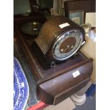 A mantel clock and a wall clock.