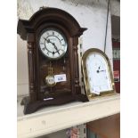 Two mantel clocks, one being duchateau