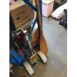 A canoe / kayak paddle and a golf trolley