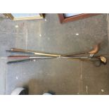 4 vintage golf clubs including one with hickory shaft