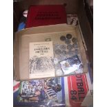 A box of football memorabilia including 39 1972 FA cup coins, 1955 big book of champions Panini's