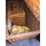 Two wicker baskets and contents including a vintage teddy bear and sheet music.