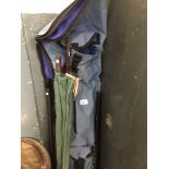 A fishing rod bag with two vintage 12ft match rods, an umbrella, a ground spike and a telescopic