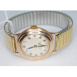 A vintage 9ct gold cased 15 jewel manual wind wristwatch, the dial unsigned and having Arabic