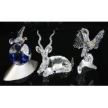 A group of three Swarovski animal figures comprising Crystal Planet 2000 Dove of Peace, Annual