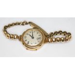 A 1930s hallmarked 9ct gold ladies wristwatch, the unsigned guilloche dial having Arabic numerals