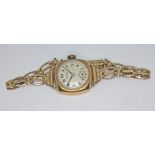 A 1950s hallmarked 9ct gold Rotary 15 jewel manual wind ladies wristwatch on rolled gold strap,