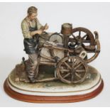 A large Capodimonte figure group "The knife grinder with Cart", signed Sandro Maggioni, 1979, on