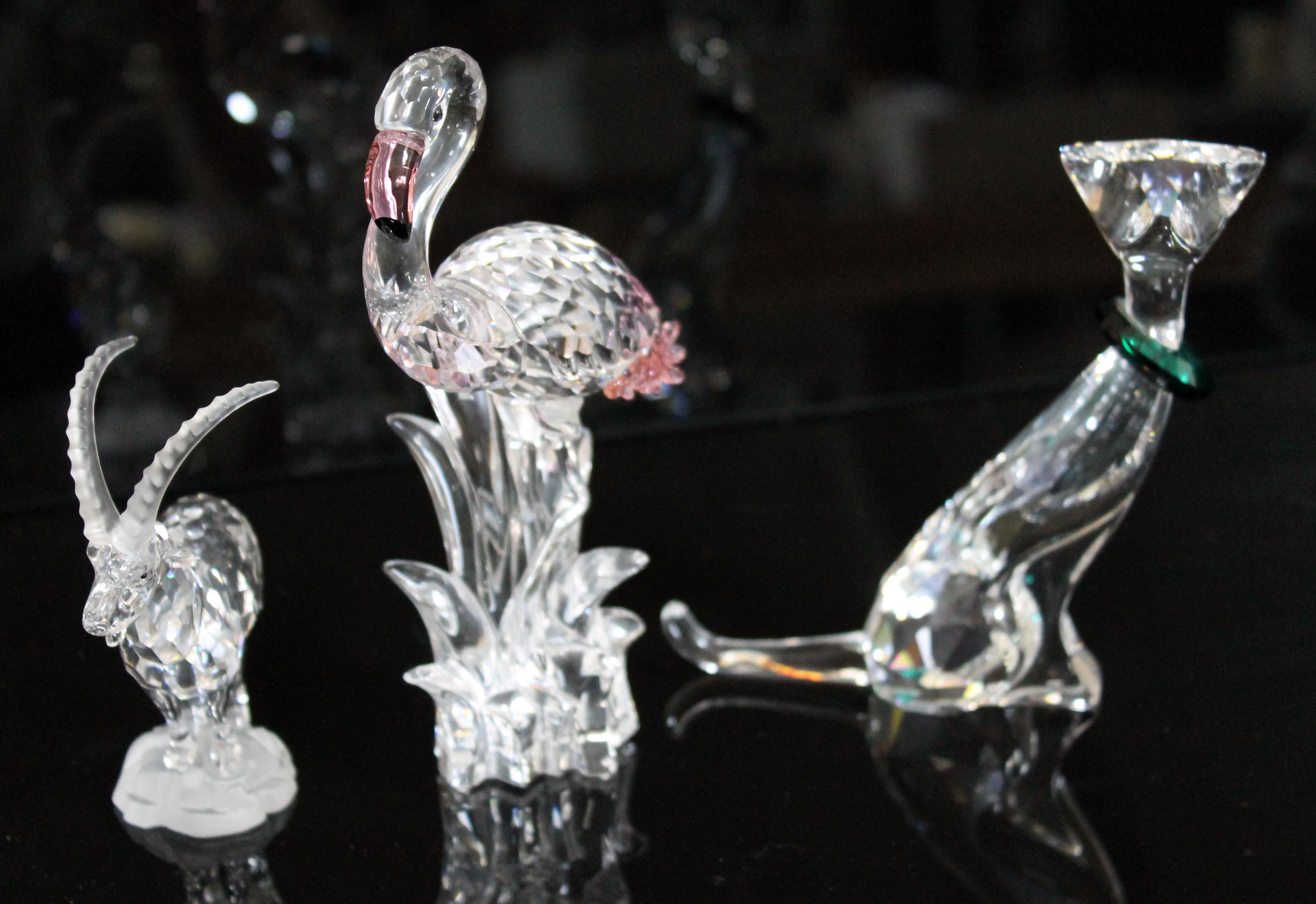 Three Swarovski figures comprising Flamingo, Crystal Symbols Cat with green collar and Sable