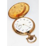 A late 19th century 14k gold Swiss full hunter pocket watch with unsigned white enamel dial having
