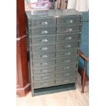 Green metal utilitarian drawers.