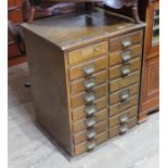 A utilitarian elm chest of drawers with cup handles, height 72cm.