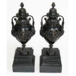 A pair of 19th century urns with twin handles, on marble bases, height 38cm. Good condition overall