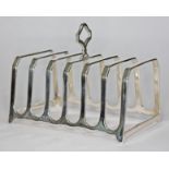 A silver toast rack, Bravington's, Birmingham 1937, length 11.5cm, wt. 4oz.