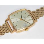 A vintage 1973 hallmarked 9ct gold Omega Genéve automatic wristwatch with signed champagne dial,