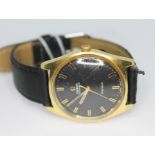 A 1968 gold plated Omega Genéve 165.041 automatic wristwatch with signed black dial, baton hour