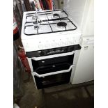 An Indesit electric cooker with gas hob