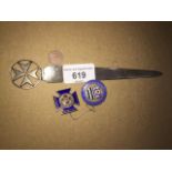 Silver letter knife and two metal badges