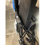 An Invacare folding wheelchair with cushion