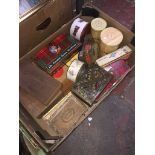 A box of vintage tins and cigar boxes