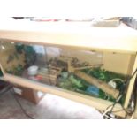 A Exo terra reptile cage with accessories and bulbs.