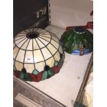 A large and medium sized Tiffany style glass lampshades.