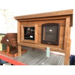 A pet hutch and wooden bird house