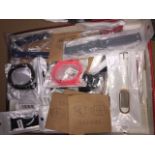 A box of watch straps and screen protectors