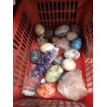 A basket of mixed rocks, gems, crystals, etc.