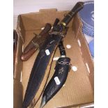 TRwo Kukri knives and two daggers