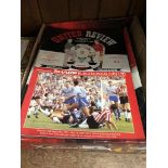 A box of 30 Man United football programmes.