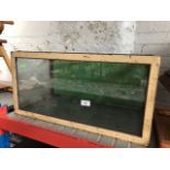 A vintage glass and metal framed tank