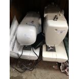 Three cased electric sewing machines, Singer, Husqvarna and Argos, all as seen.