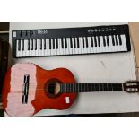 A MK61 Midi keyboard - no power cable and a Challenge CH-C30 acoustic guitar