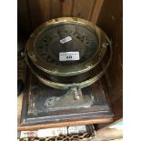 A ships compass on wood plinth - N.V. Observator, Rotterdam.