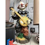 A resin/plastic large clown figure.