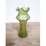 A Loetz Austrian Art Nouveau iridescent green glass vase of bulbous form with crimped rim, height
