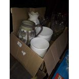 A box of planters and glass vases, and a box of glassware and pottery
