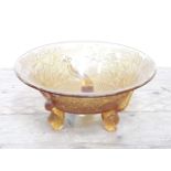 A Sowerby pressed yellow glass bowl with fish feet, diam. 22cm.