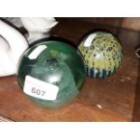 A Victorian green glass dump and a Mdina glass paperweight.