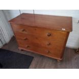 A pine chest of drawers.